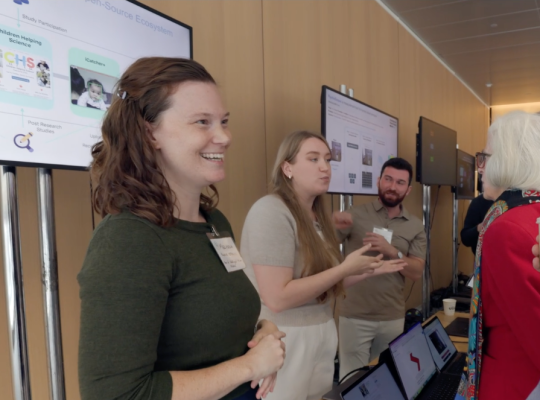 Melissa Kline Struhl speaks to others at a conference