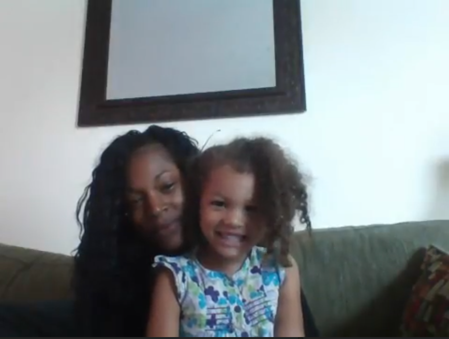 A mother and child participating in a Children Helping Science research study.