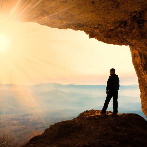 person looking at a bright horizon