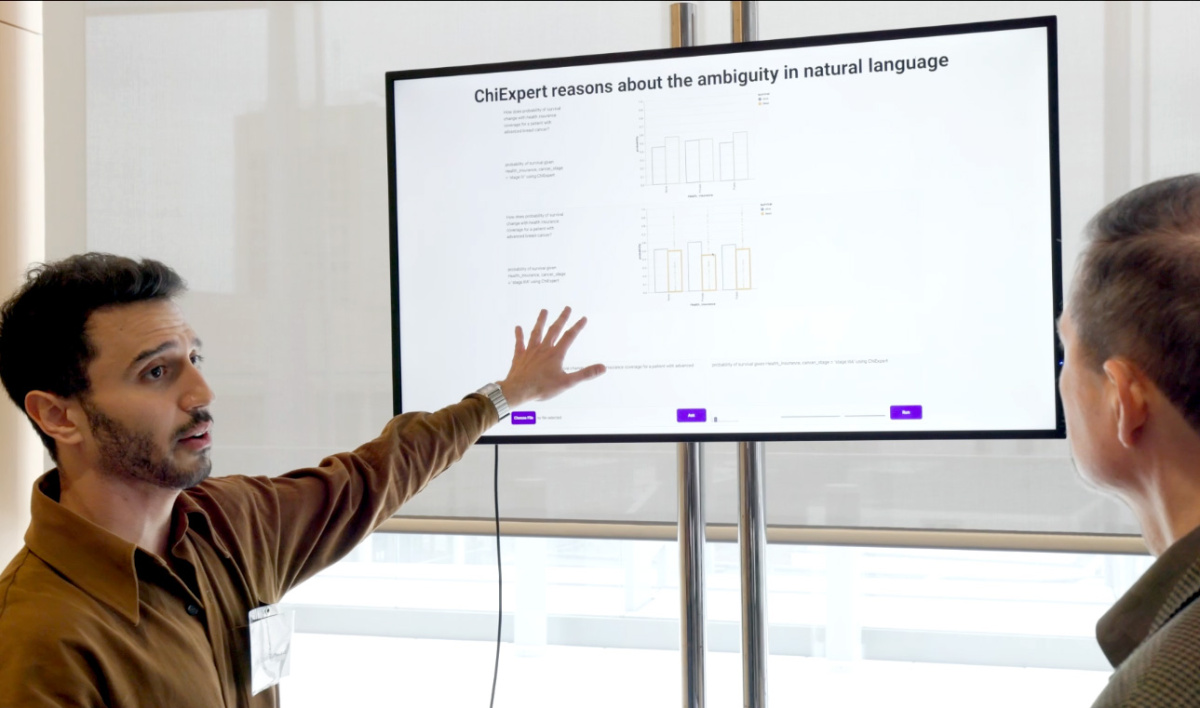 Image of a student presenting UROP research at a conference.