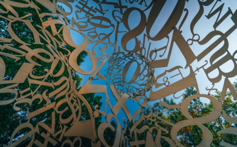 letters and symbols against a blue sky